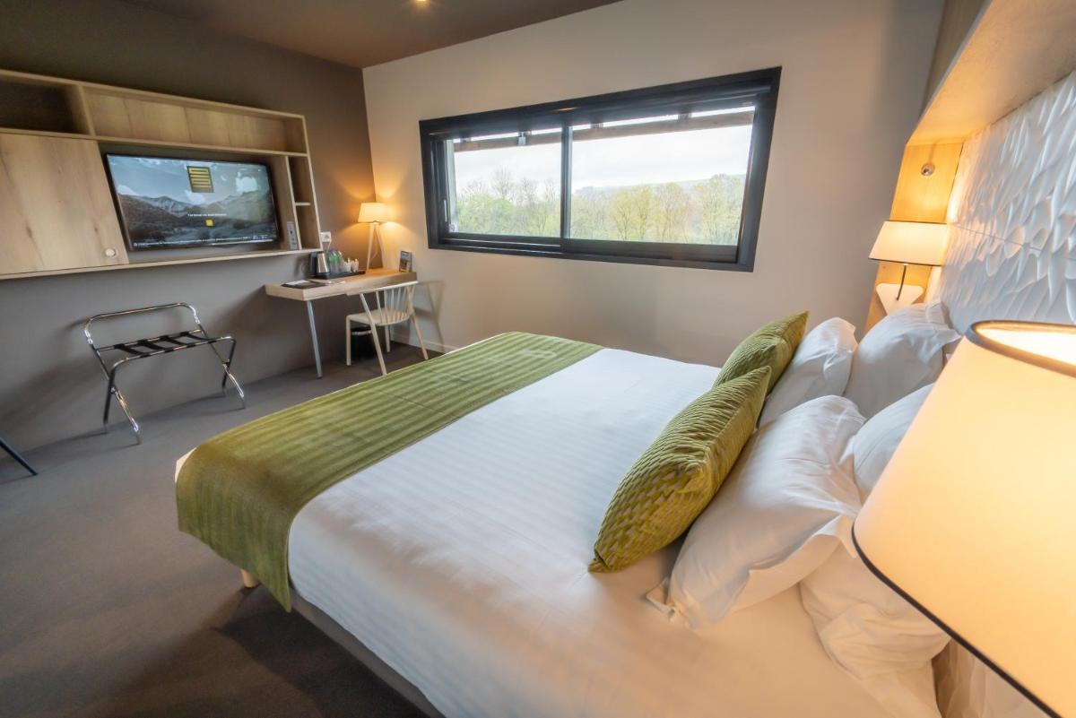 Un ou plusieurs lits dans un hébergement de l'établissement Mildiss Hotel Spa & Restaurant, BW Signature Collection