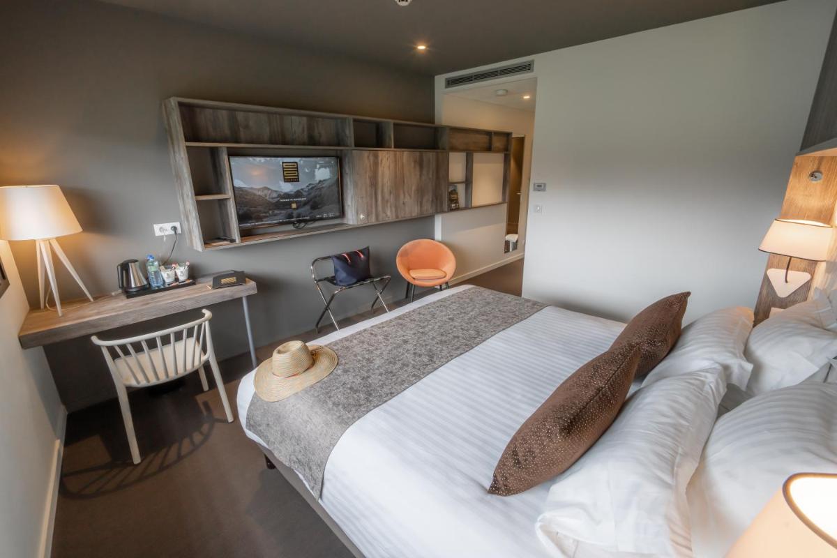 Un ou plusieurs lits dans un hébergement de l'établissement Mildiss Hotel Spa & Restaurant, BW Signature Collection