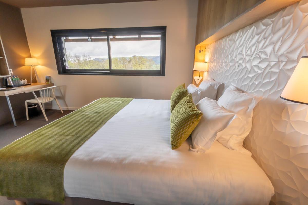 Un ou plusieurs lits dans un hébergement de l'établissement Mildiss Hotel Spa & Restaurant, BW Signature Collection