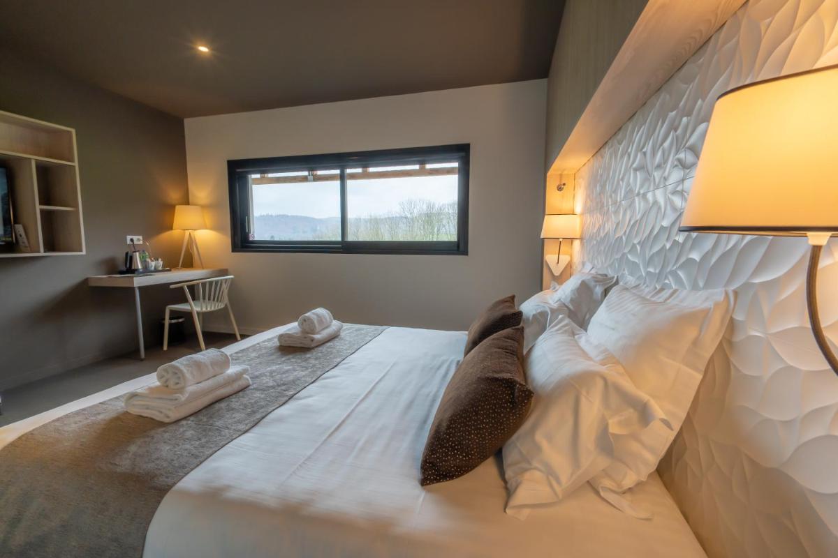 Un ou plusieurs lits dans un hébergement de l'établissement Mildiss Hotel Spa & Restaurant, BW Signature Collection