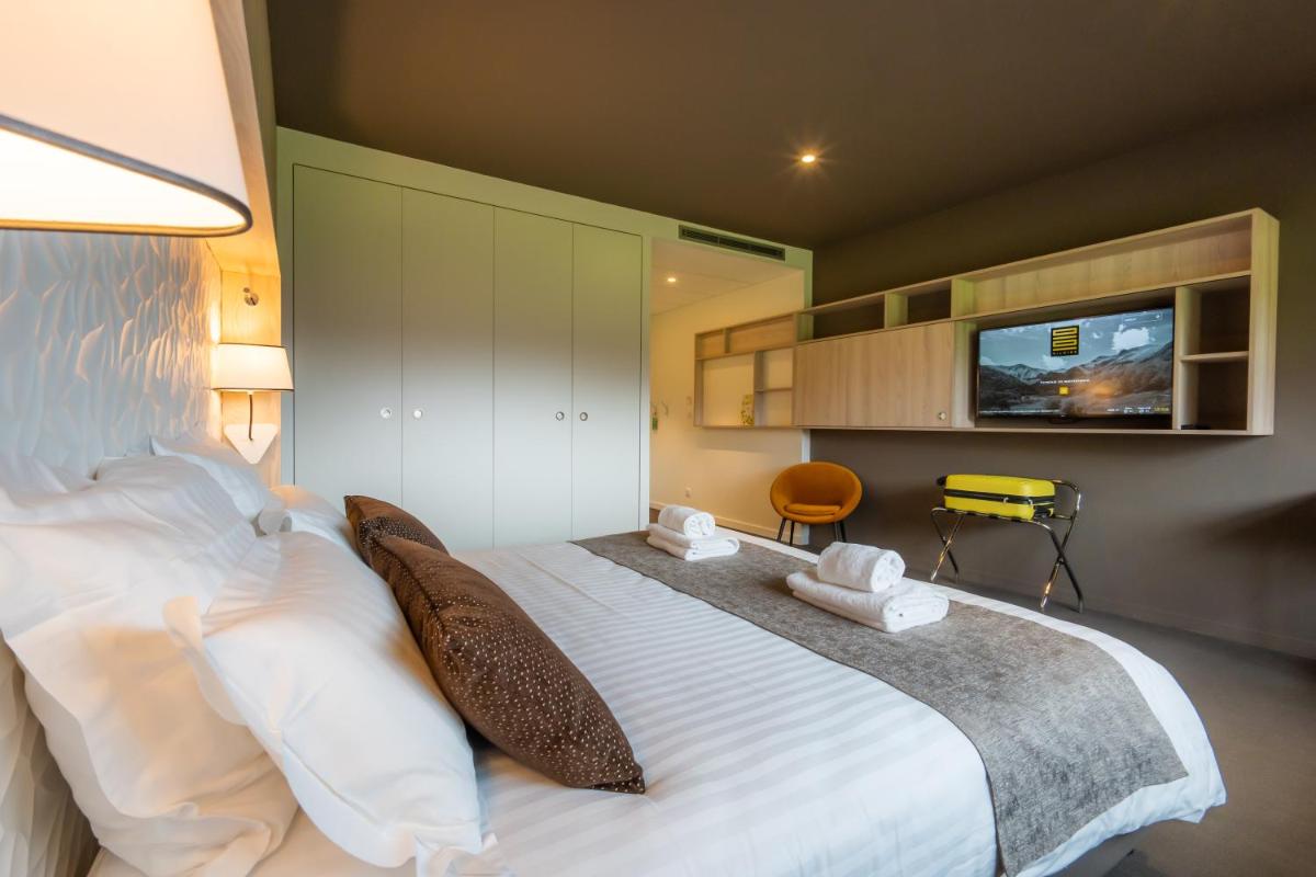Un ou plusieurs lits dans un hébergement de l'établissement Mildiss Hotel Spa & Restaurant, BW Signature Collection