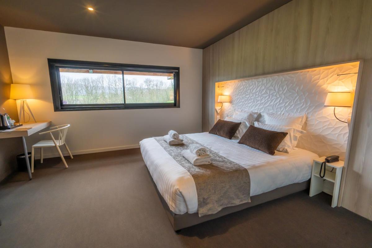 Un ou plusieurs lits dans un hébergement de l'établissement Mildiss Hotel Spa & Restaurant, BW Signature Collection