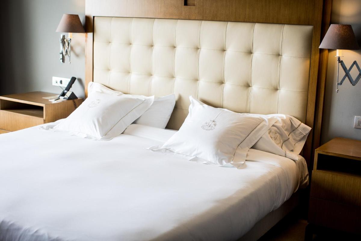 Cama o camas de una habitación en Pazo Los Escudos Hotel Spa & Resort
