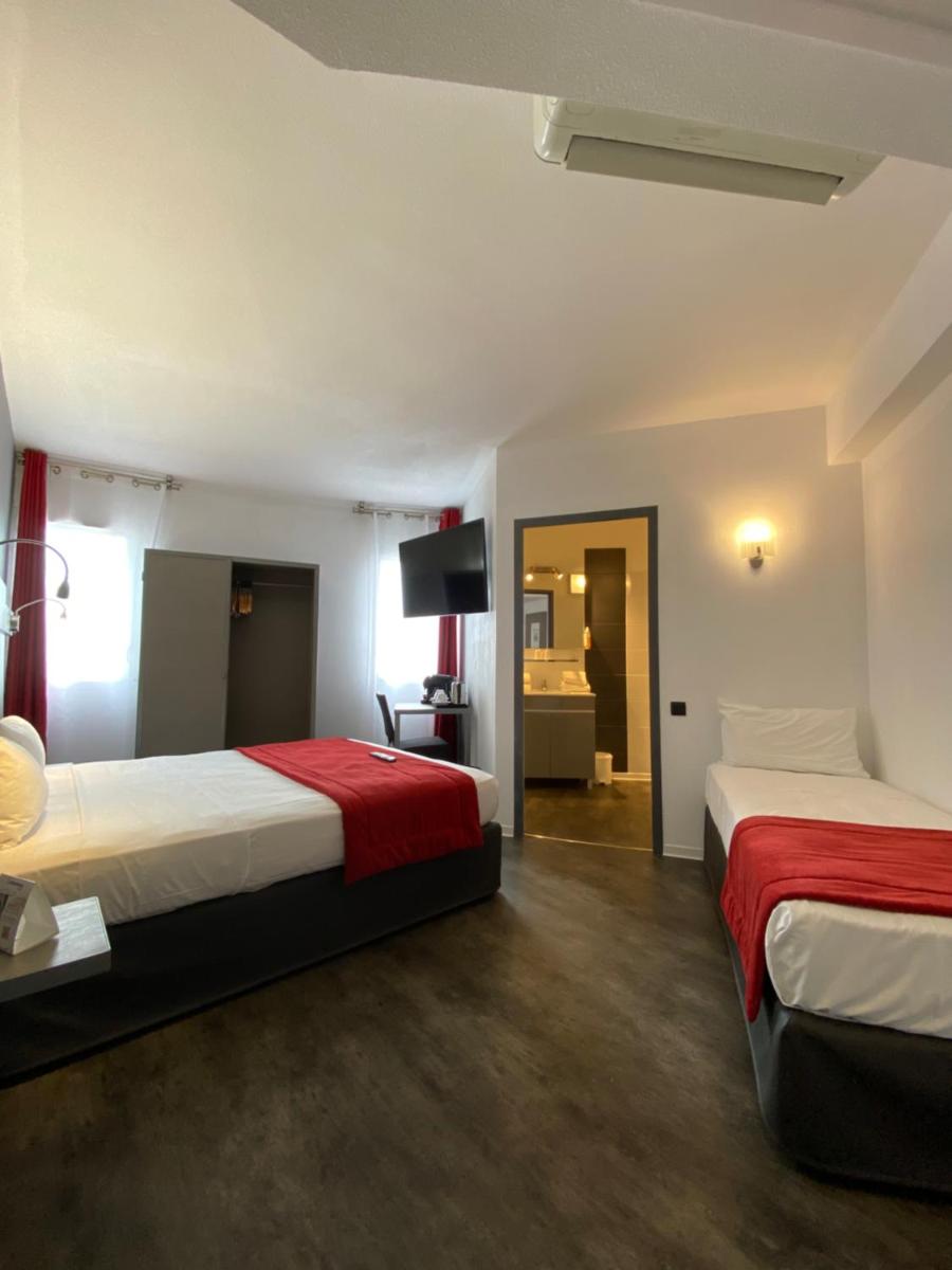 Un ou plusieurs lits dans un hébergement de l'établissement The Originals City, Hôtel Les Dômes, Perpignan Sud Saleilles