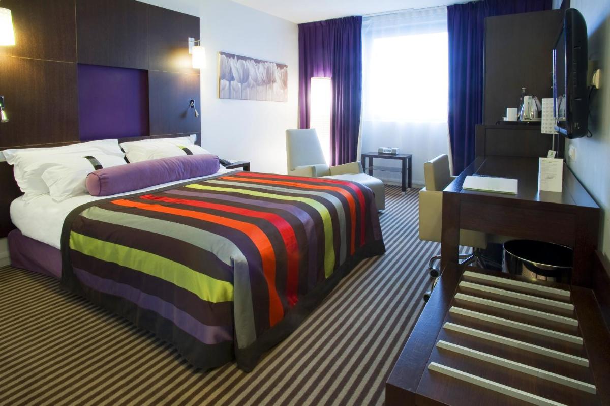 Un ou plusieurs lits dans un hébergement de l'établissement Holiday Inn Dijon Toison D'or by IHG