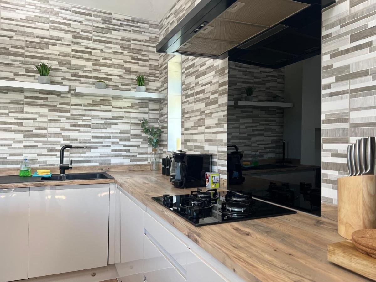 The Broadway Beach homes AirBnb with Hot tub - Housity