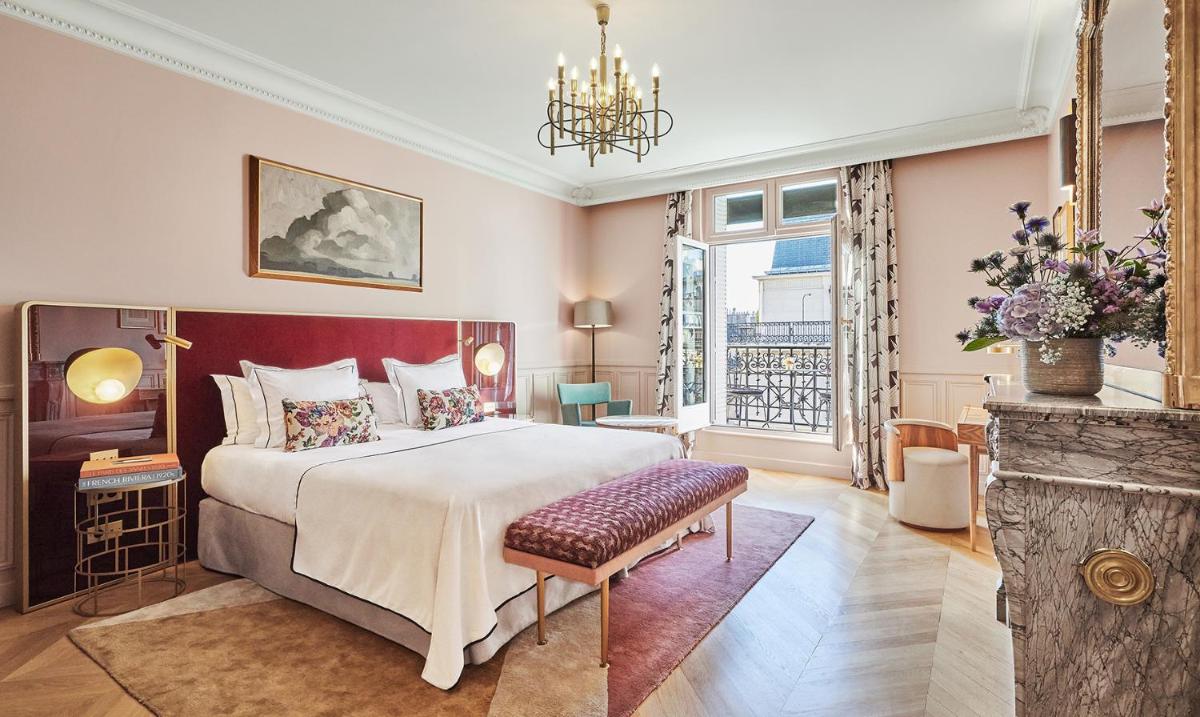 Un ou plusieurs lits dans un hébergement de l'établissement Grand Powers Hotel