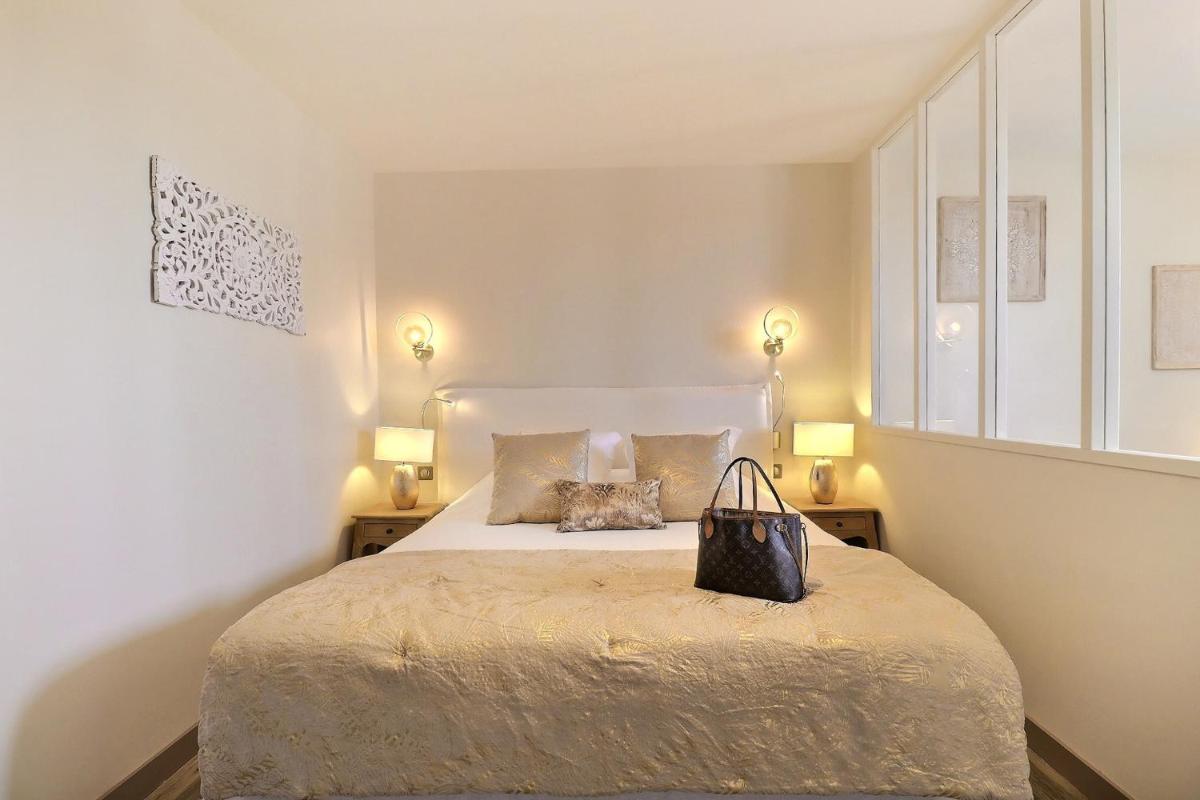 Un ou plusieurs lits dans un hébergement de l'établissement Grand Hôtel des Bains SPA