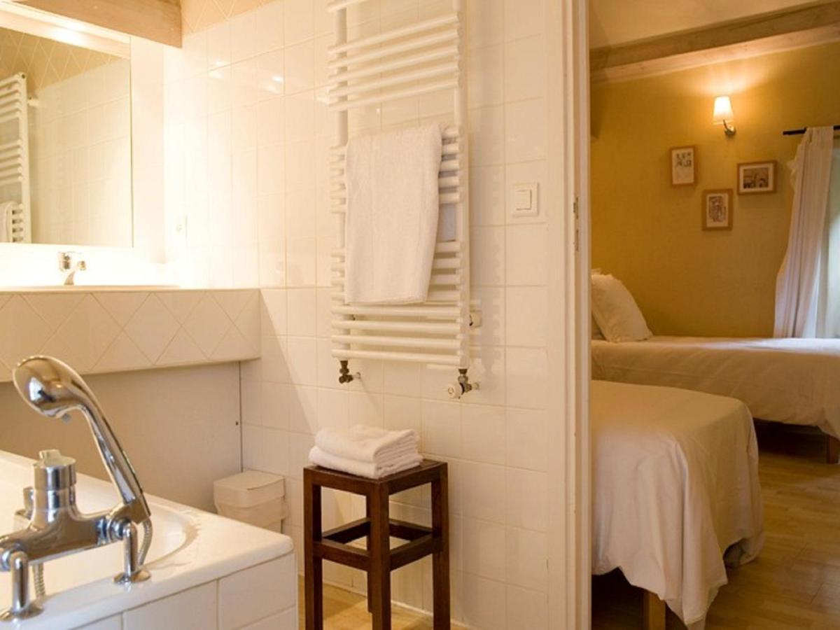 Un ou plusieurs lits dans un hébergement de l'établissement Hotel La Bougnate