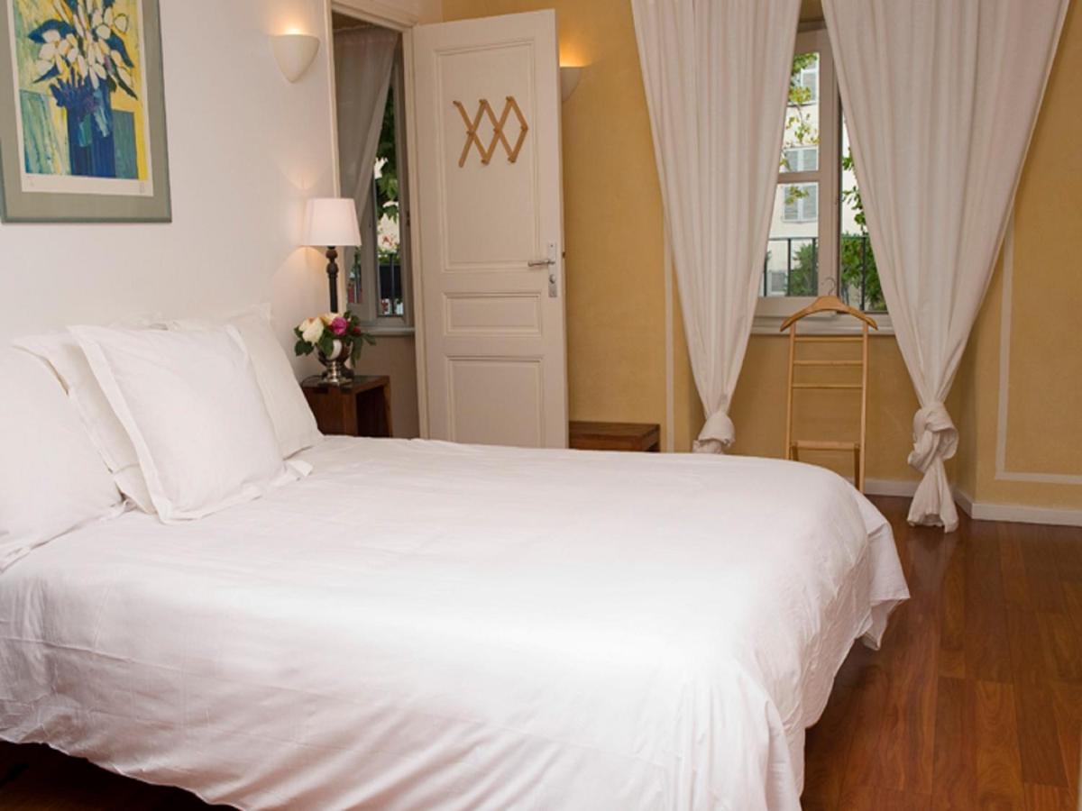 Un ou plusieurs lits dans un hébergement de l'établissement Hotel La Bougnate