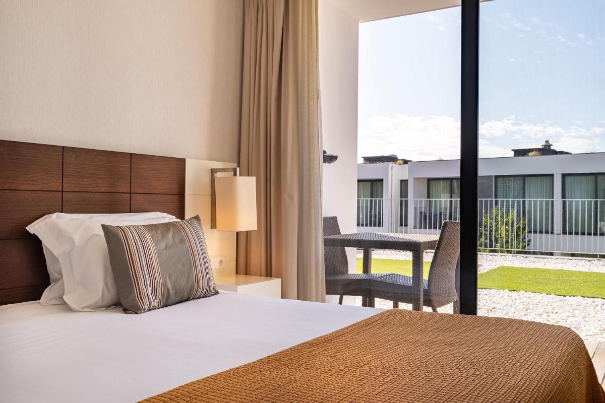 Uma cama ou camas num quarto em Monchique Resort & Spa