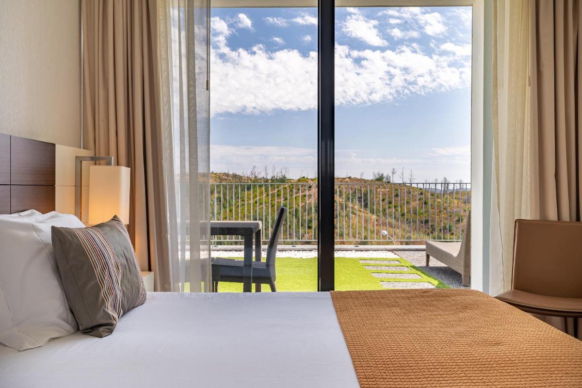 Uma cama ou camas num quarto em Monchique Resort & Spa