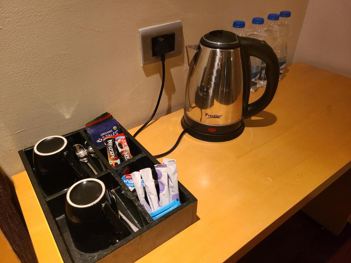 a coffee maker sitting on top of a table at Novotel Hyderabad Airport in Hyderabad