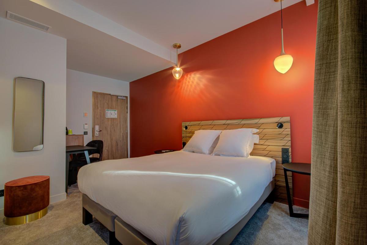 Un ou plusieurs lits dans un hébergement de l'établissement Alex Hotel & Spa