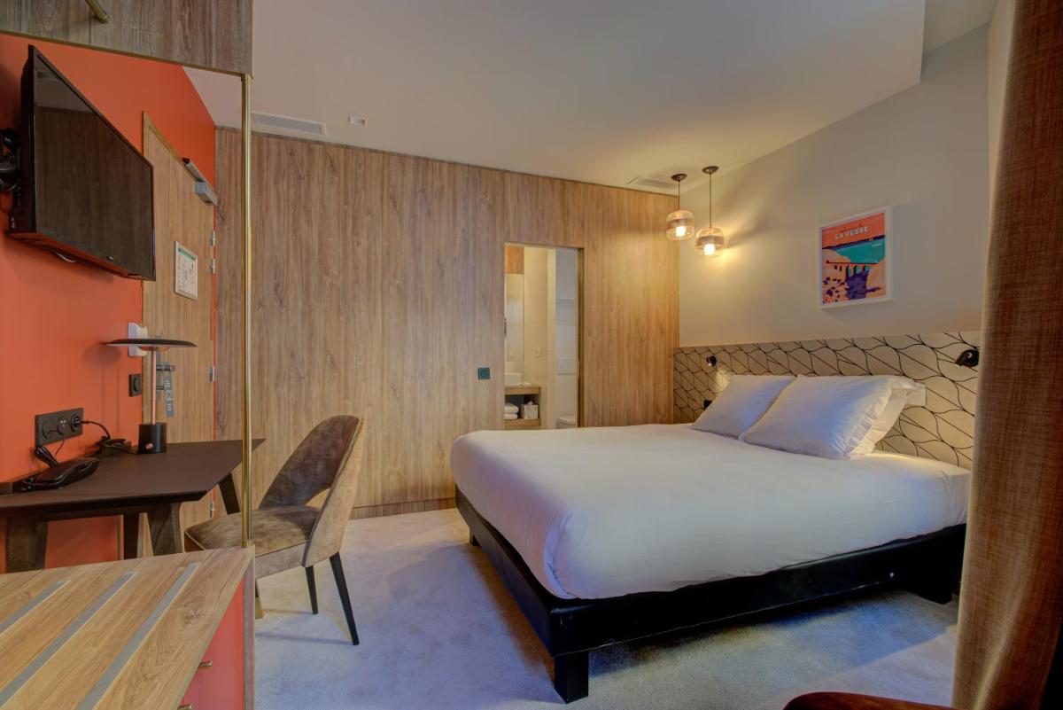 Un ou plusieurs lits dans un hébergement de l'établissement Alex Hotel & Spa