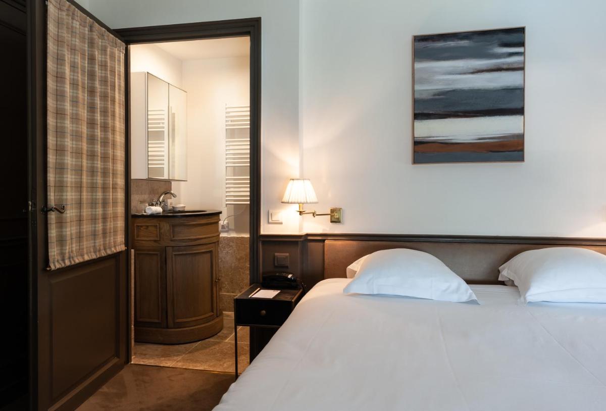 Un ou plusieurs lits dans un hébergement de l'établissement Château de Courban and Spa Nuxe