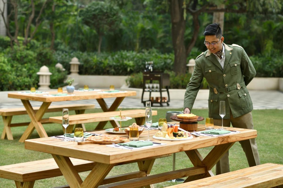 a man standing in front of a picnic table at Taj Mahal, New Delhi in New Delhi