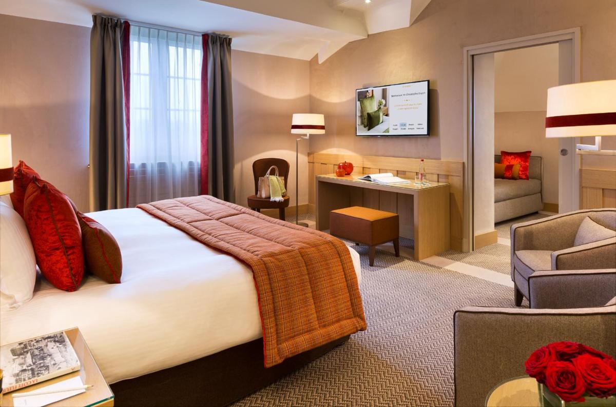 Un ou plusieurs lits dans un hébergement de l'établissement Hôtel Barrière L'Hôtel du Golf