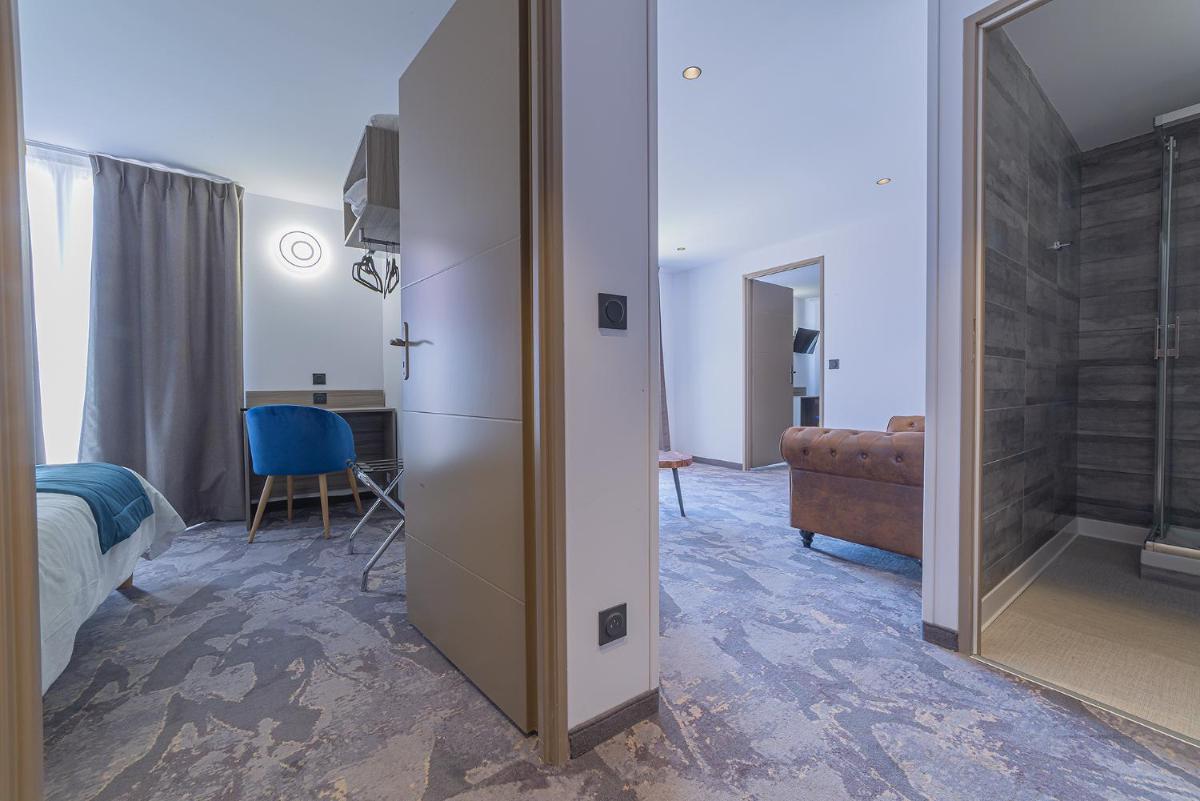 Un ou plusieurs lits dans un hébergement de l'établissement Relax'Otel & Spa, Le Barcarès