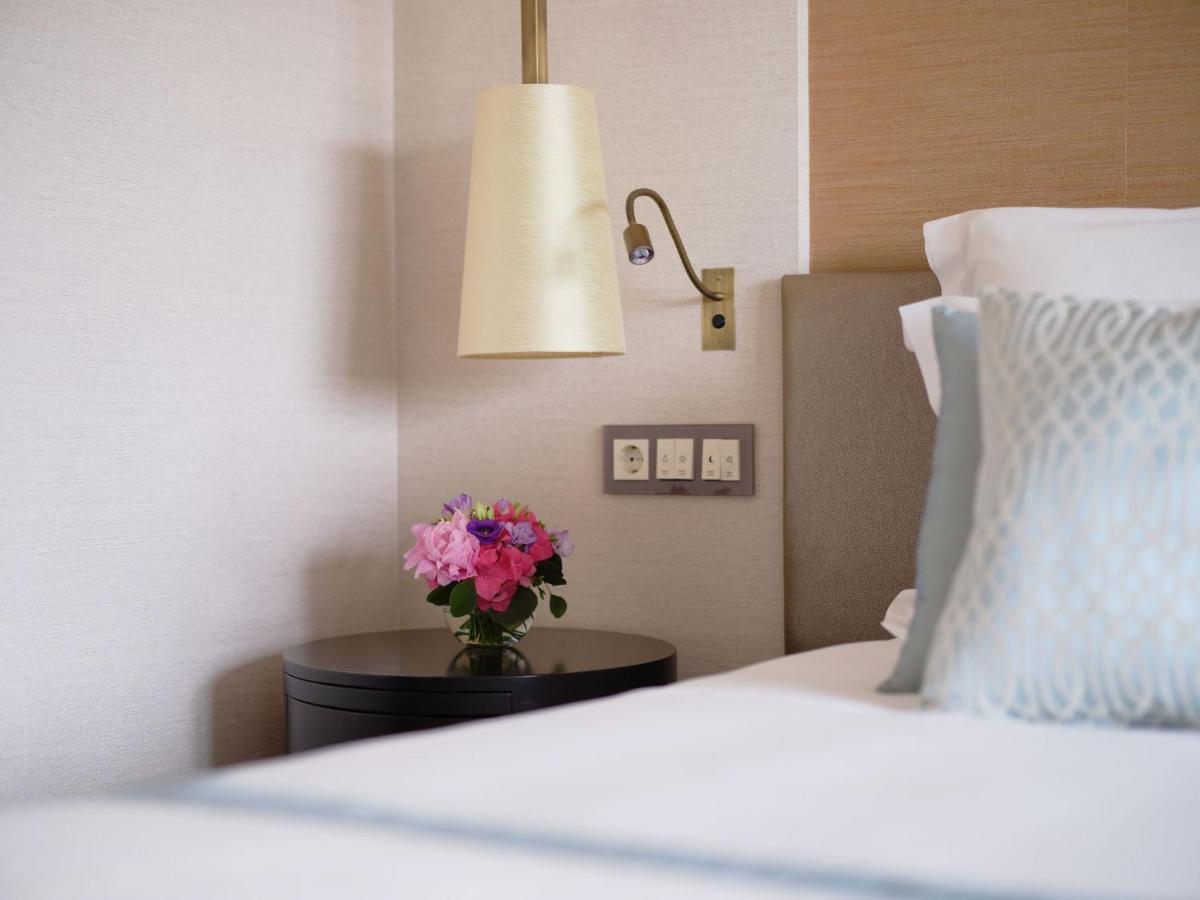 Uma cama ou camas num quarto em Corinthia Lisbon