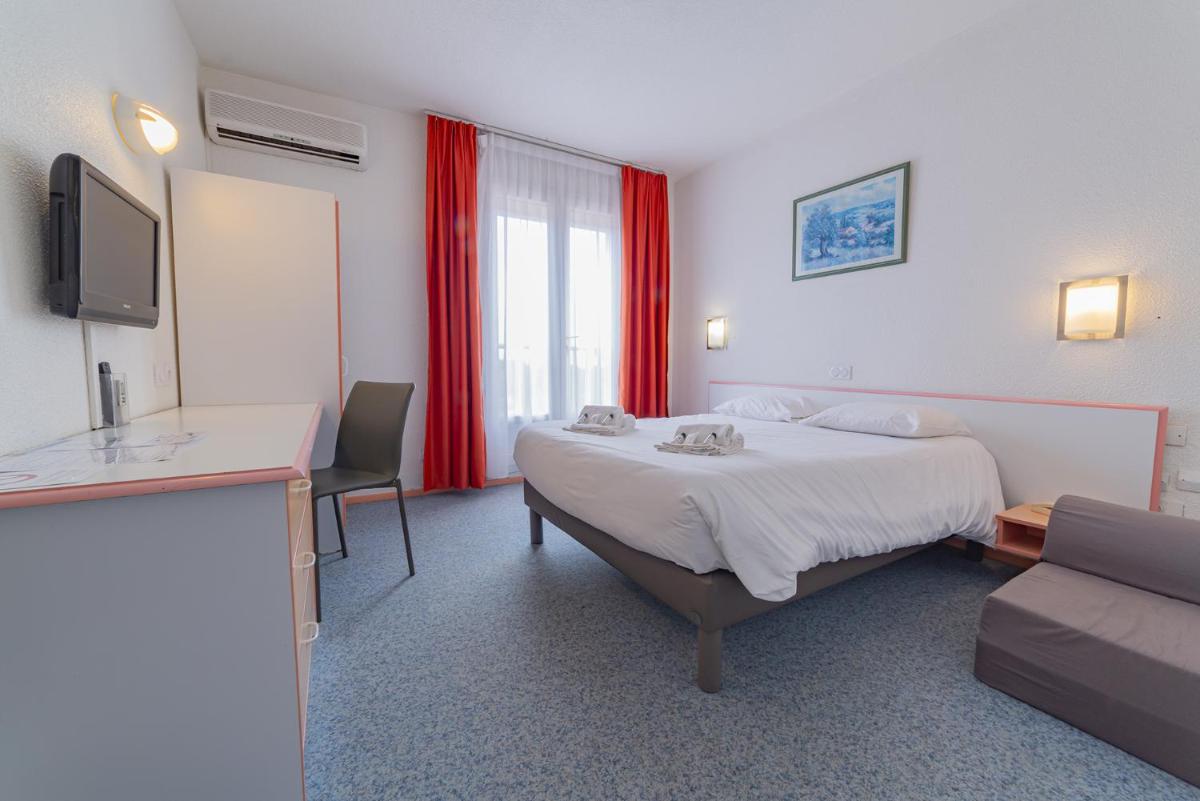 Un ou plusieurs lits dans un hébergement de l'établissement Relax'Otel & Spa, Le Barcarès