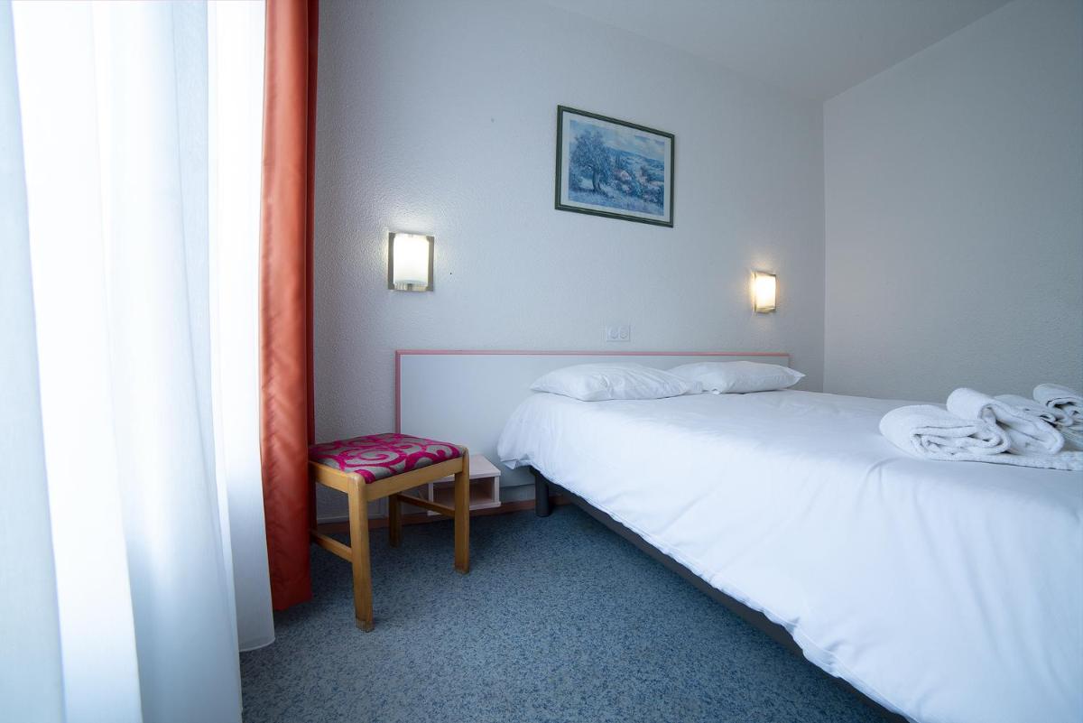 Un ou plusieurs lits dans un hébergement de l'établissement Relax'Otel & Spa, Le Barcarès