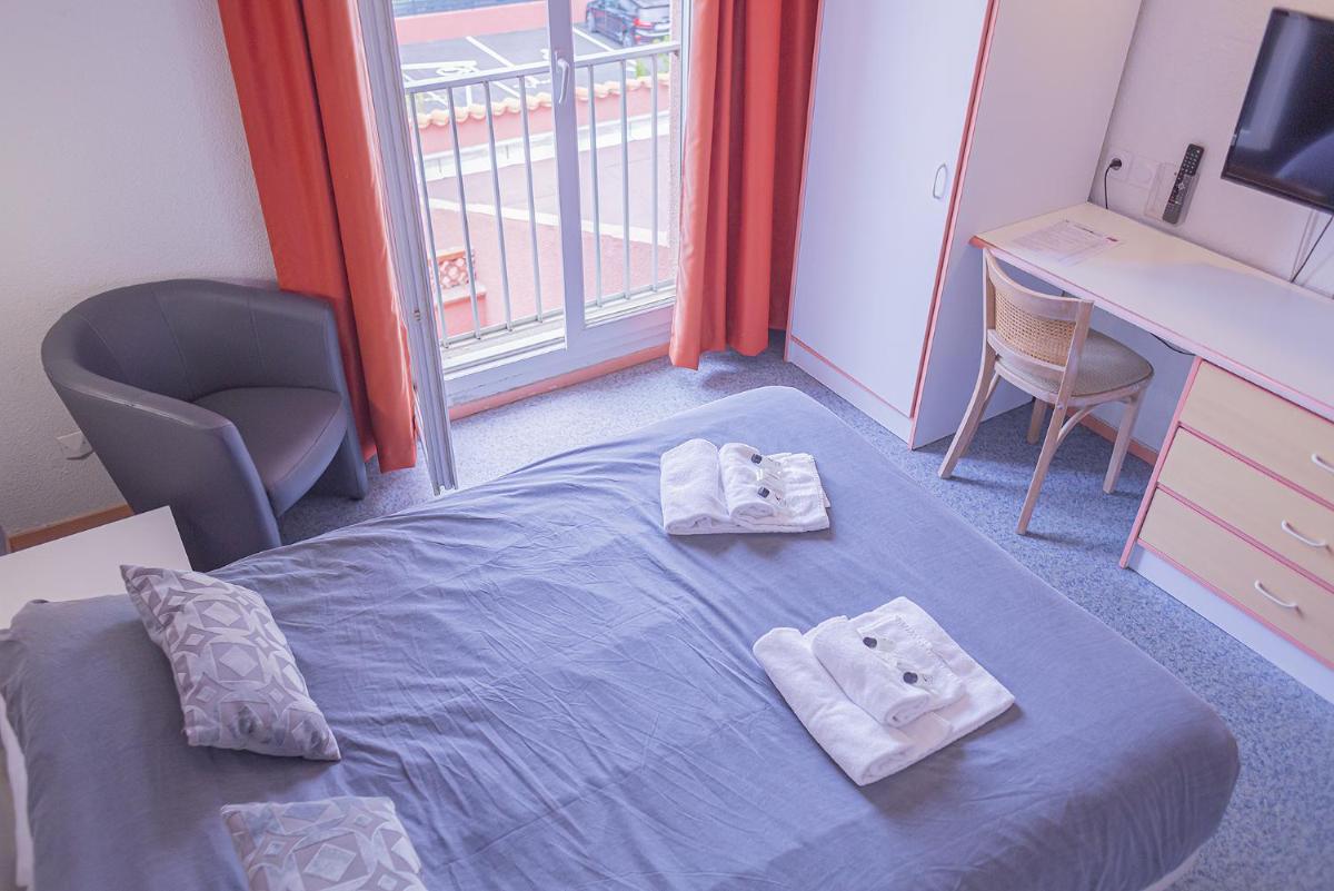 Un ou plusieurs lits dans un hébergement de l'établissement Relax'Otel & Spa, Le Barcarès