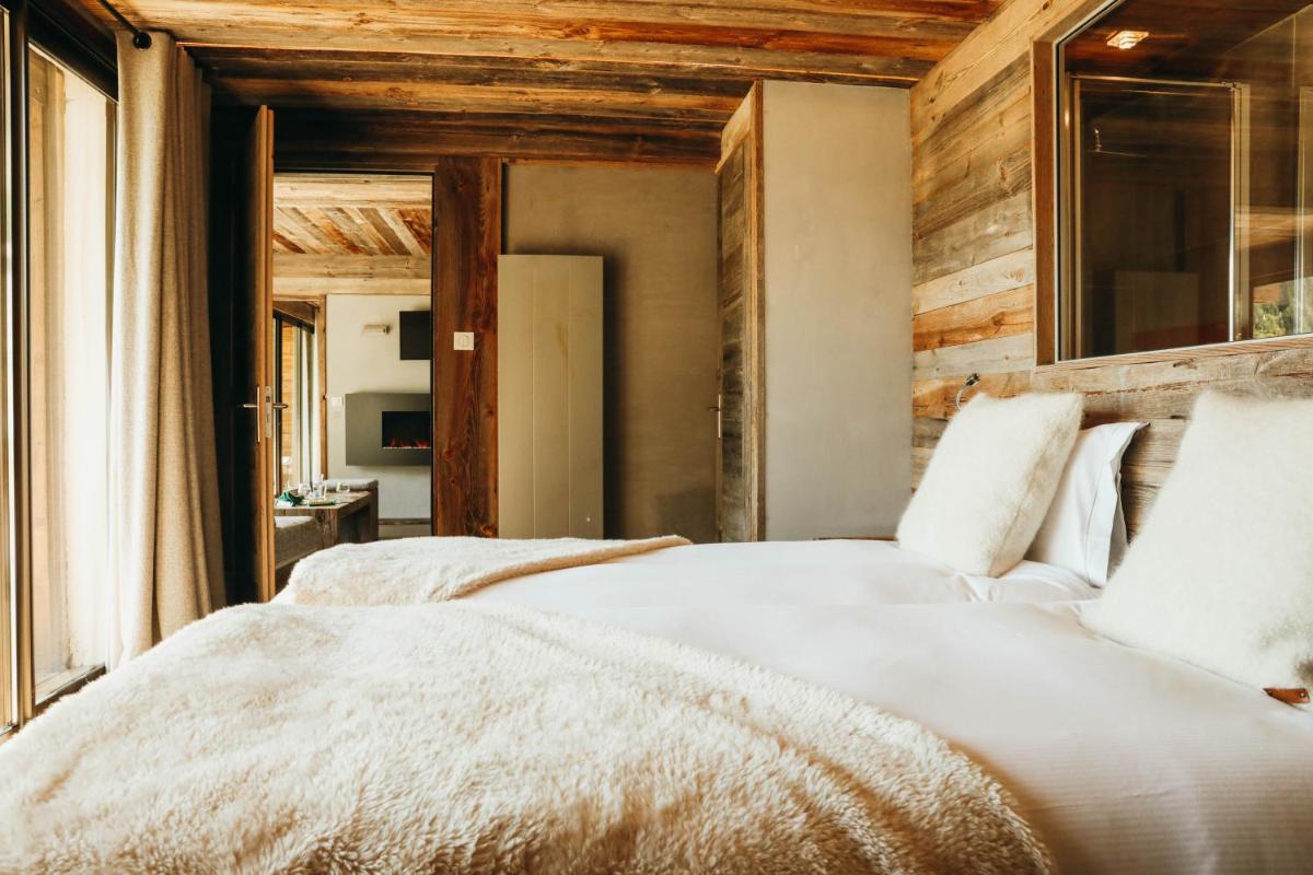 Un ou plusieurs lits dans un hébergement de l'établissement Les Grands Montets Hotel & Spa
