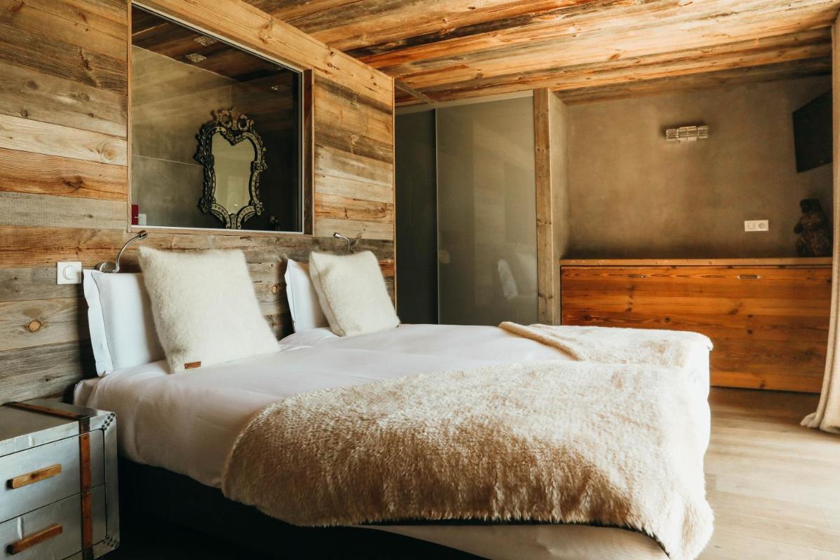 Un ou plusieurs lits dans un hébergement de l'établissement Les Grands Montets Hotel & Spa