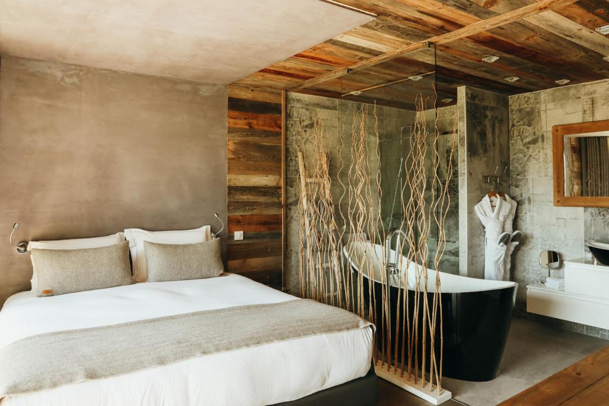 Un ou plusieurs lits dans un hébergement de l'établissement Les Grands Montets Hotel & Spa