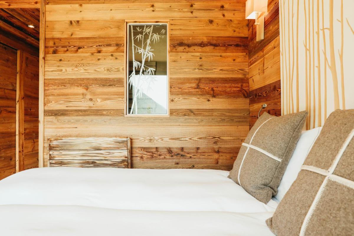 Un ou plusieurs lits dans un hébergement de l'établissement Les Grands Montets Hotel & Spa