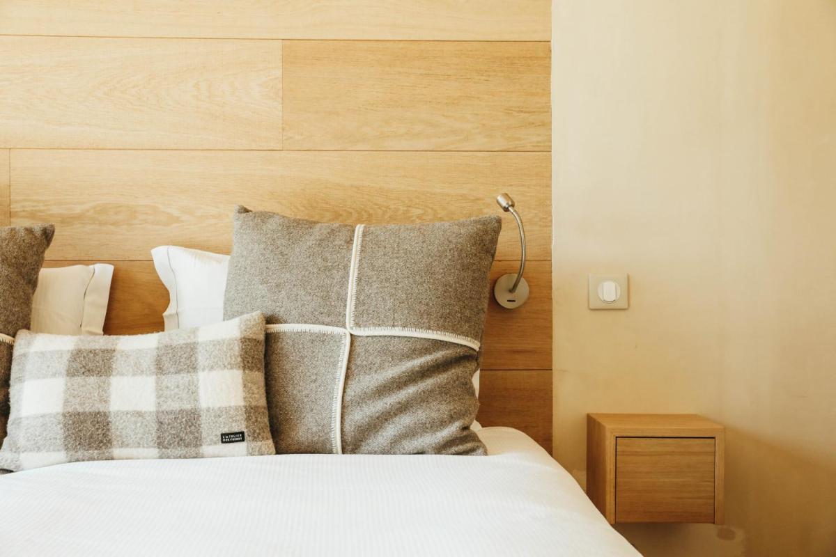 Un ou plusieurs lits dans un hébergement de l'établissement Les Grands Montets Hotel & Spa