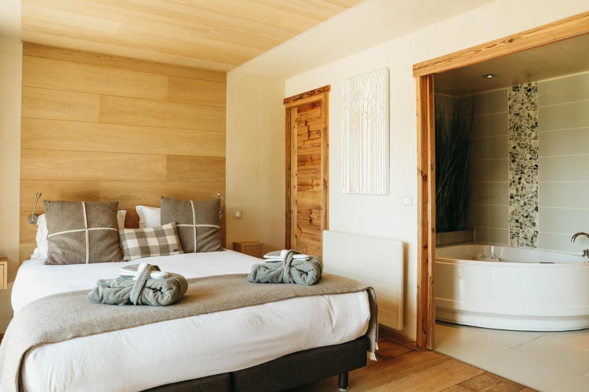 Un ou plusieurs lits dans un hébergement de l'établissement Les Grands Montets Hotel & Spa