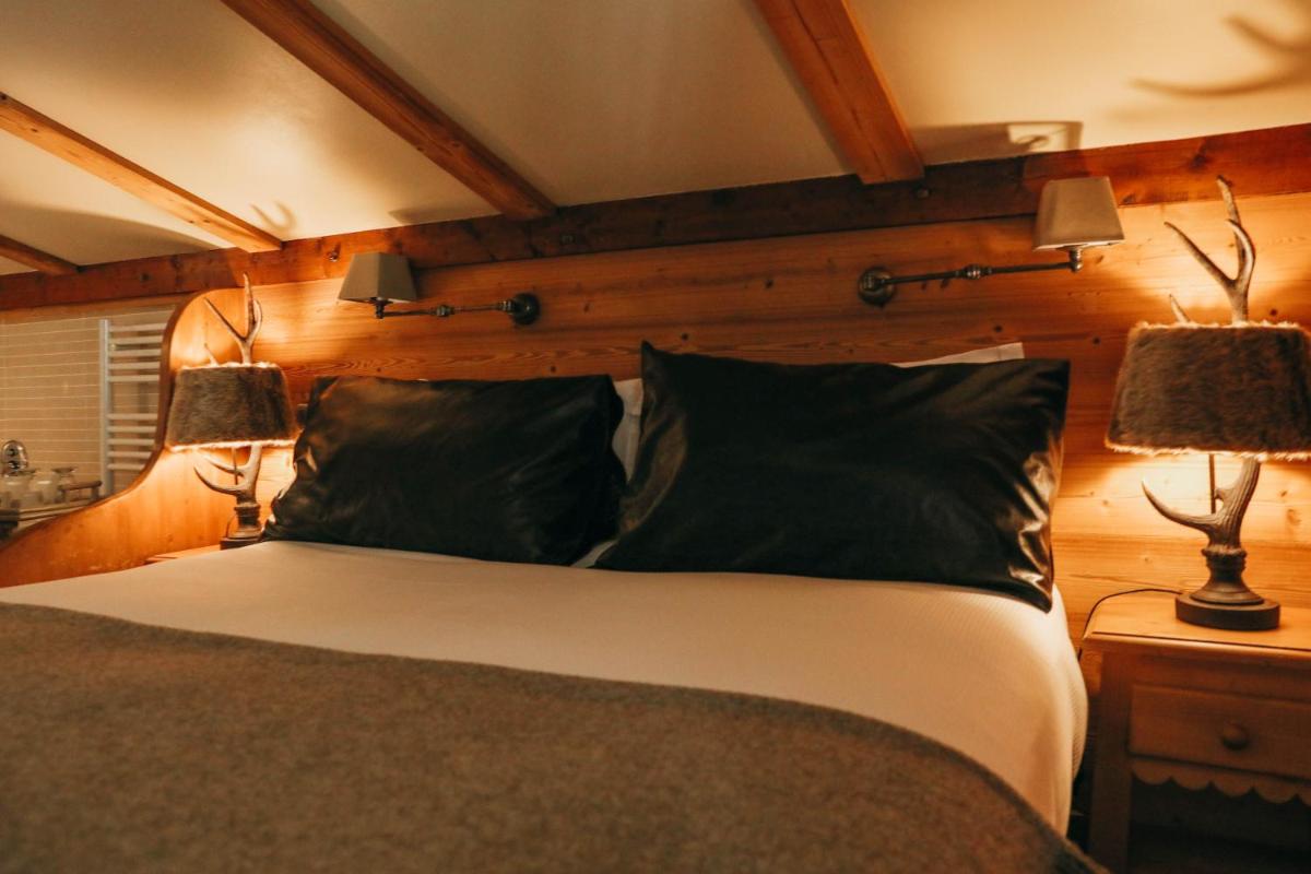 Un ou plusieurs lits dans un hébergement de l'établissement Les Grands Montets Hotel & Spa