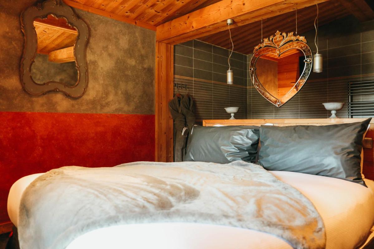 Un ou plusieurs lits dans un hébergement de l'établissement Les Grands Montets Hotel & Spa