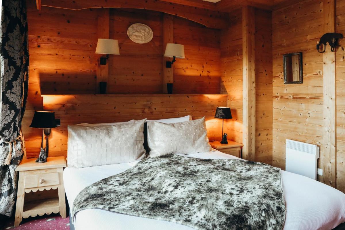 Un ou plusieurs lits dans un hébergement de l'établissement Les Grands Montets Hotel & Spa