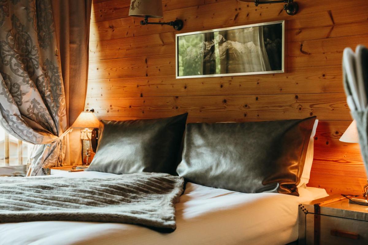 Un ou plusieurs lits dans un hébergement de l'établissement Les Grands Montets Hotel & Spa