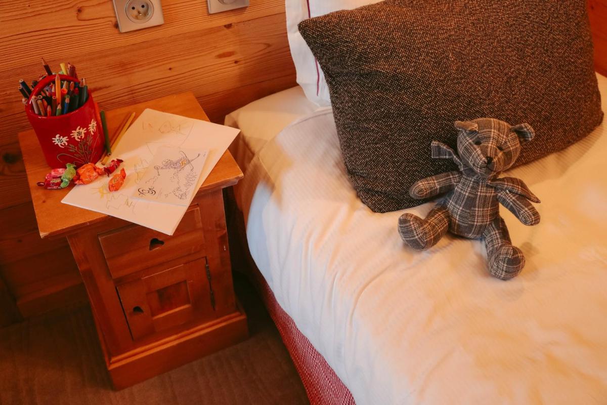 Un ou plusieurs lits dans un hébergement de l'établissement Les Grands Montets Hotel & Spa