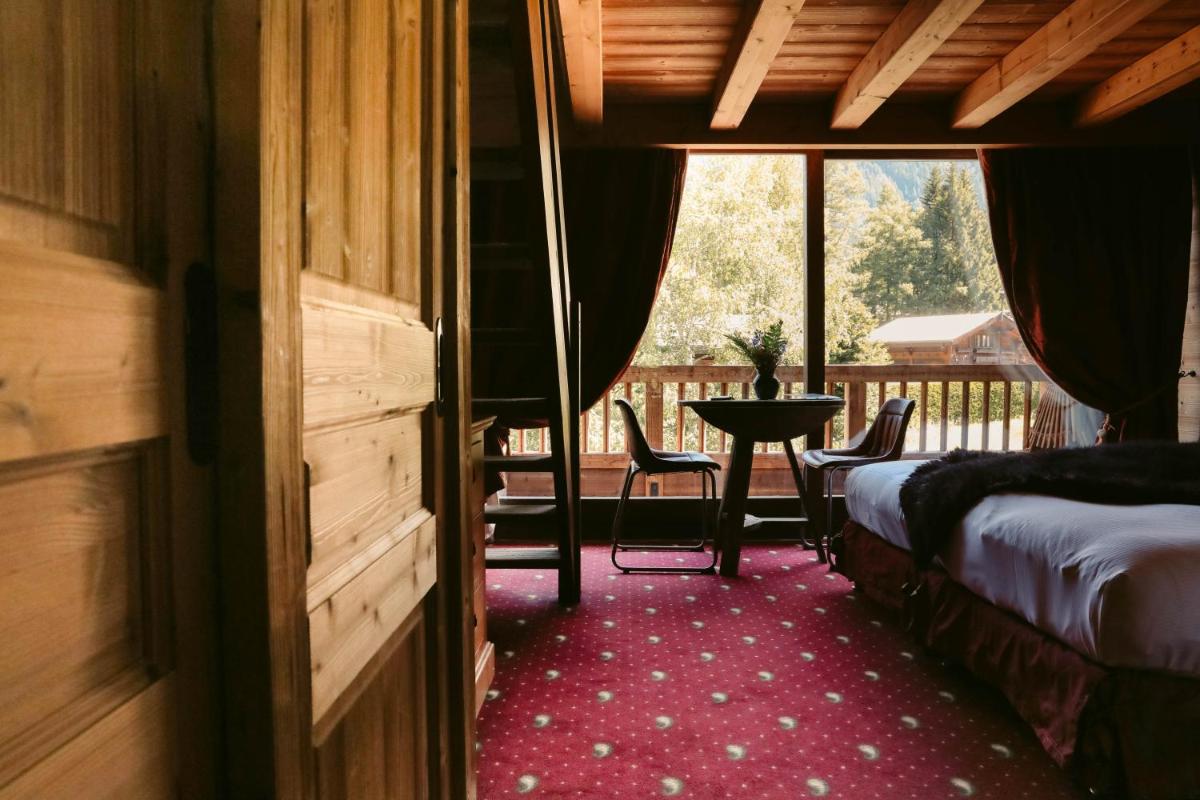 Un ou plusieurs lits dans un hébergement de l'établissement Les Grands Montets Hotel & Spa