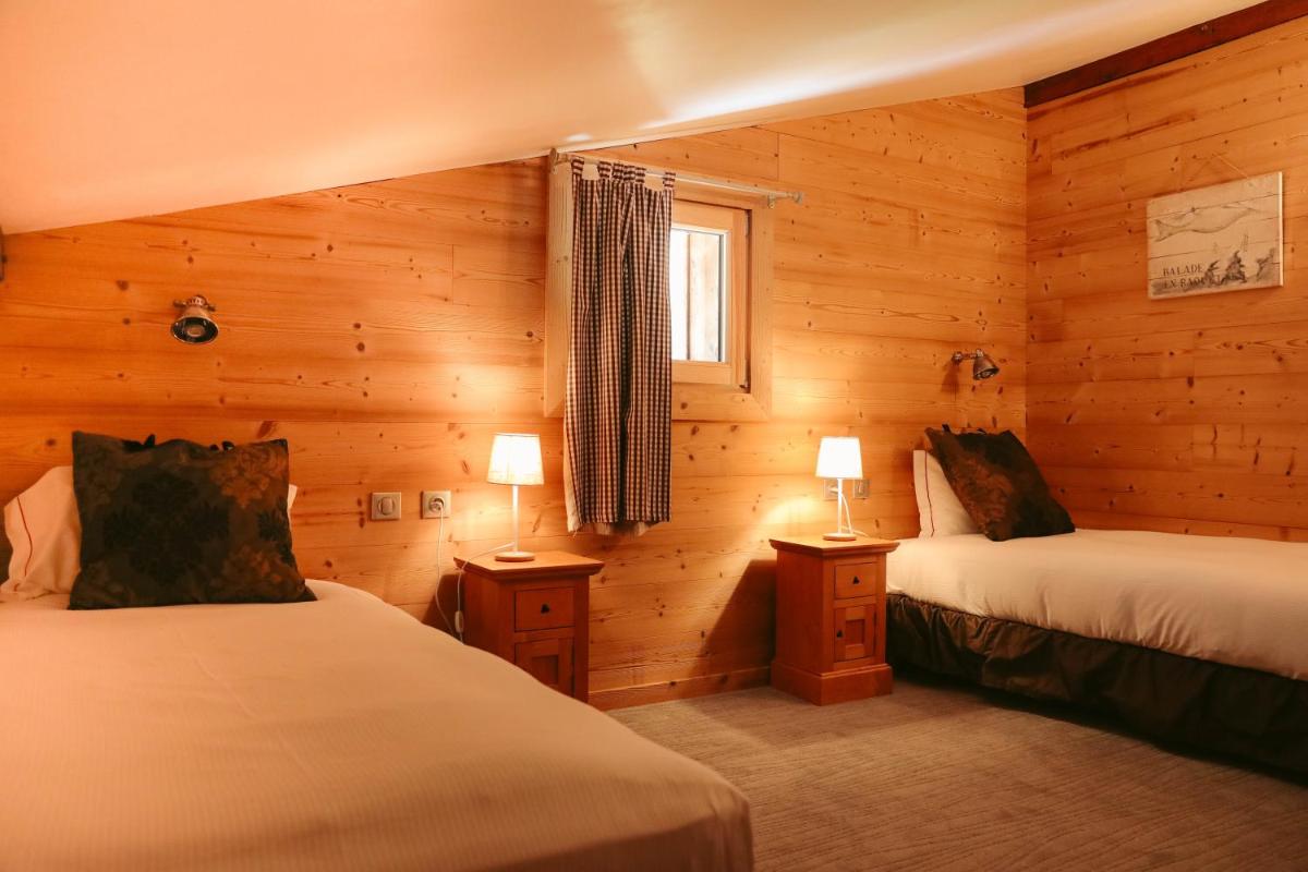 Un ou plusieurs lits dans un hébergement de l'établissement Les Grands Montets Hotel & Spa