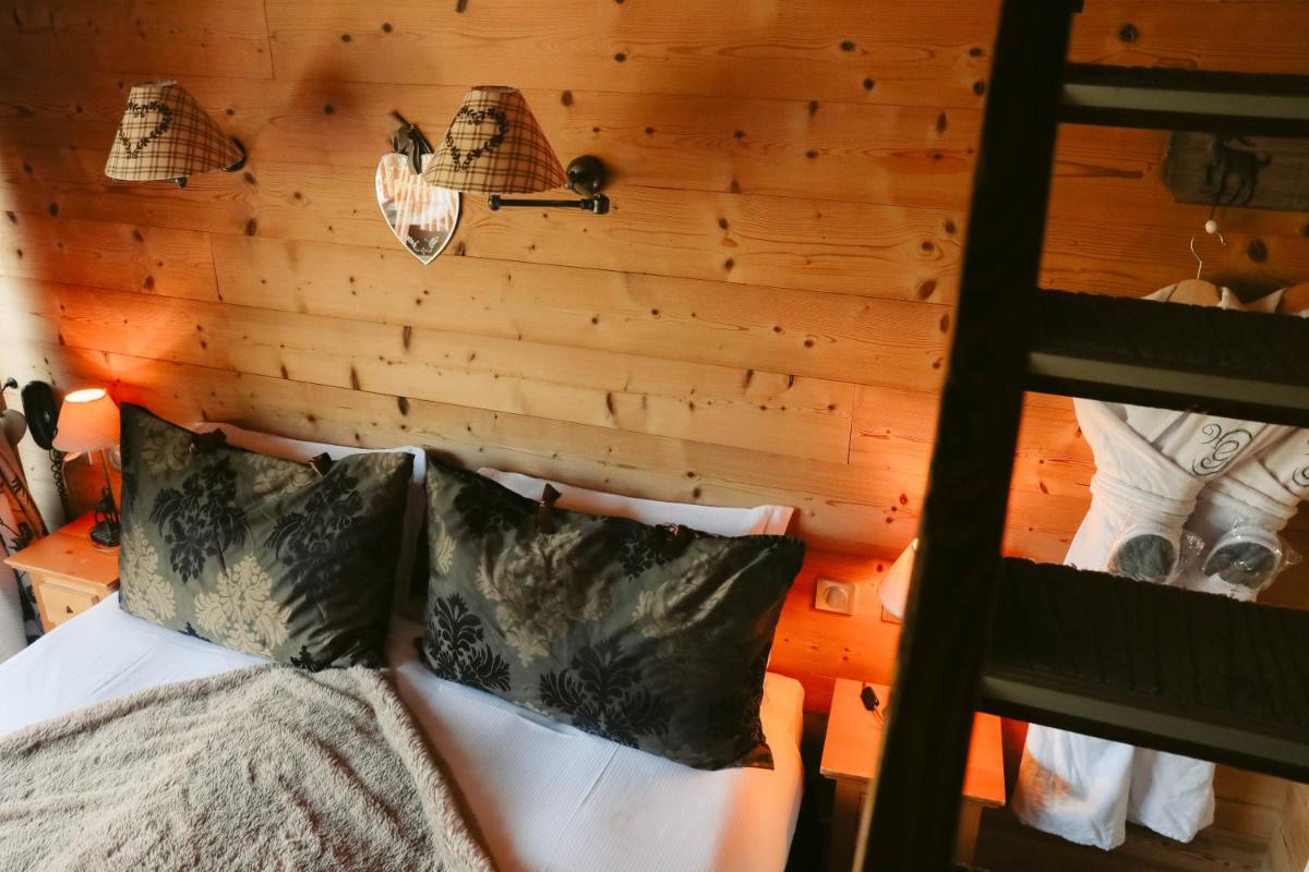 Un ou plusieurs lits dans un hébergement de l'établissement Les Grands Montets Hotel & Spa