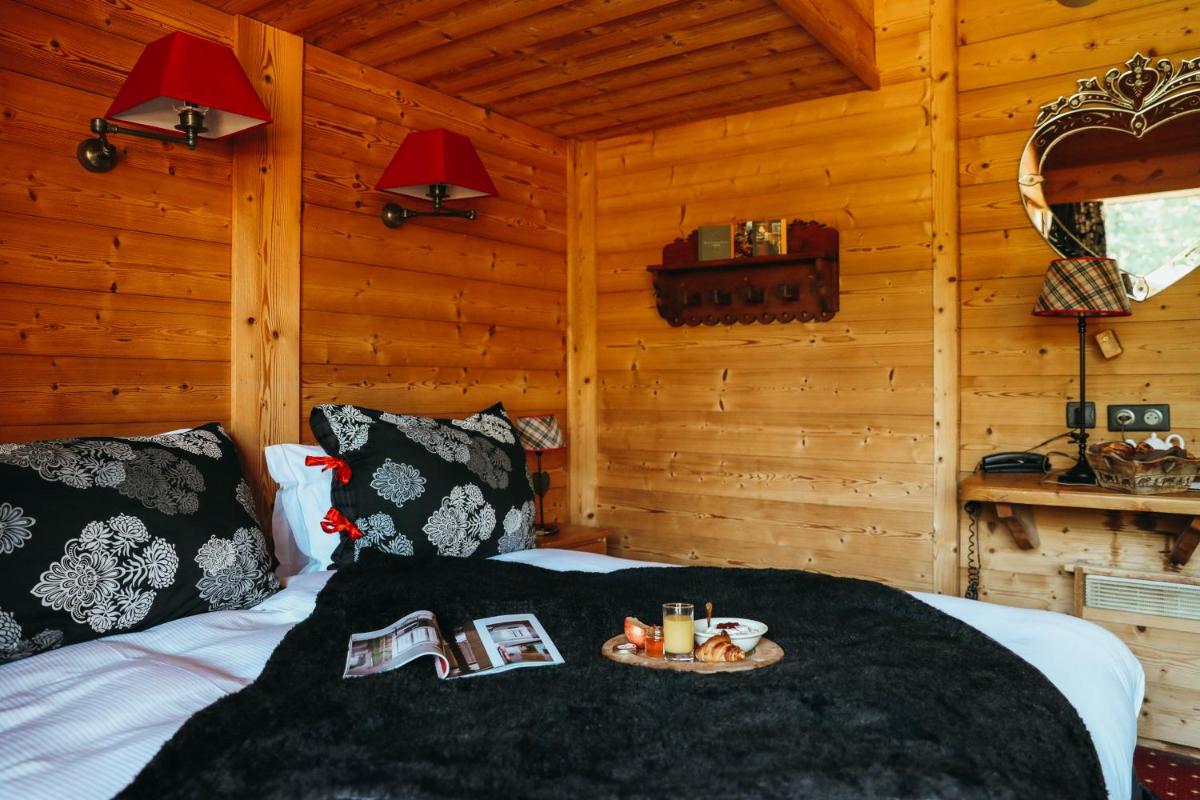 Un ou plusieurs lits dans un hébergement de l'établissement Les Grands Montets Hotel & Spa
