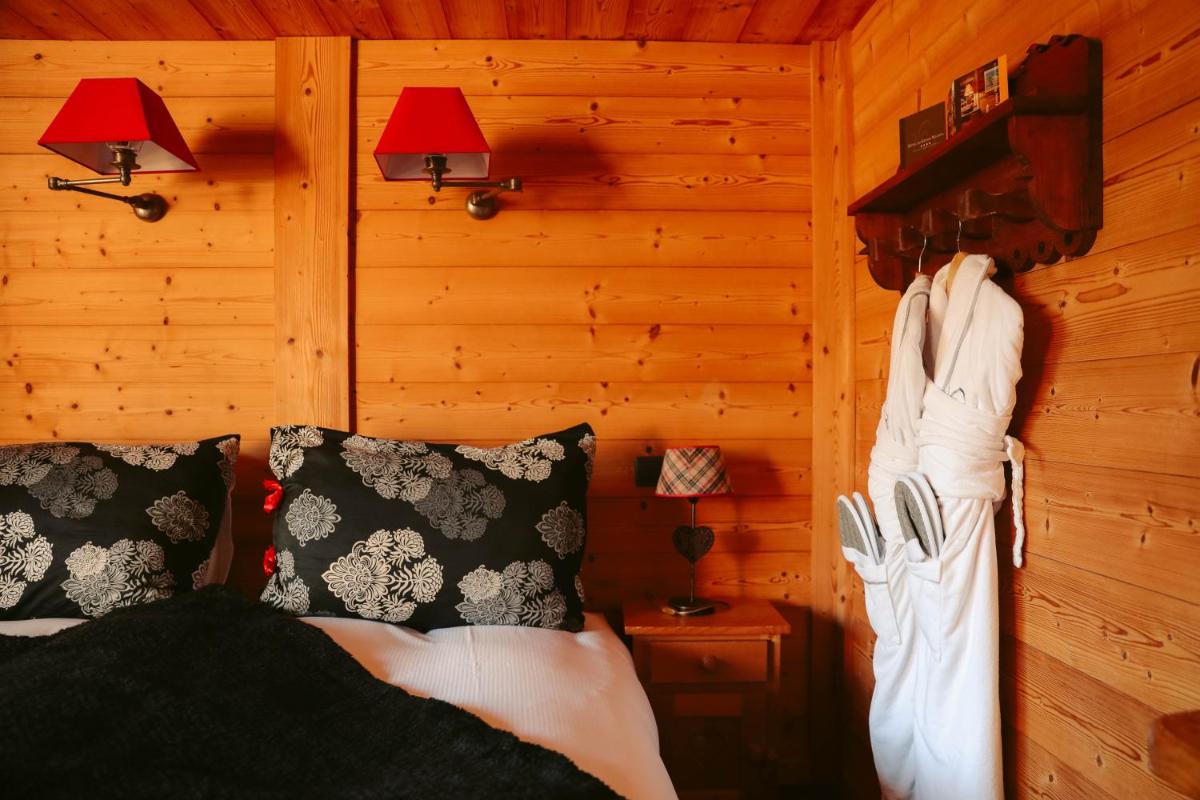 Un ou plusieurs lits dans un hébergement de l'établissement Les Grands Montets Hotel & Spa