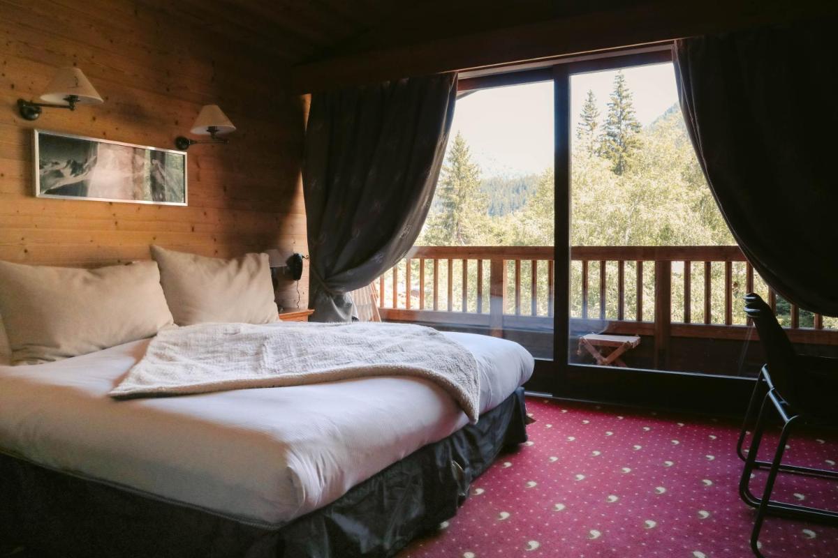 Un ou plusieurs lits dans un hébergement de l'établissement Les Grands Montets Hotel & Spa