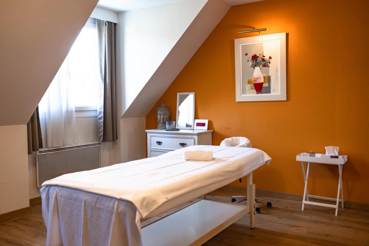 Un ou plusieurs lits dans un hébergement de l'établissement Tulip Inn Honfleur Residence & Spa
