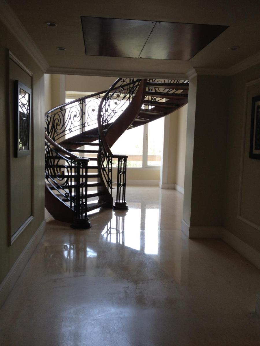 a spiral staircase in a room with a hallway at Blue Diamond Pune IHCL SeleQtions in Pune