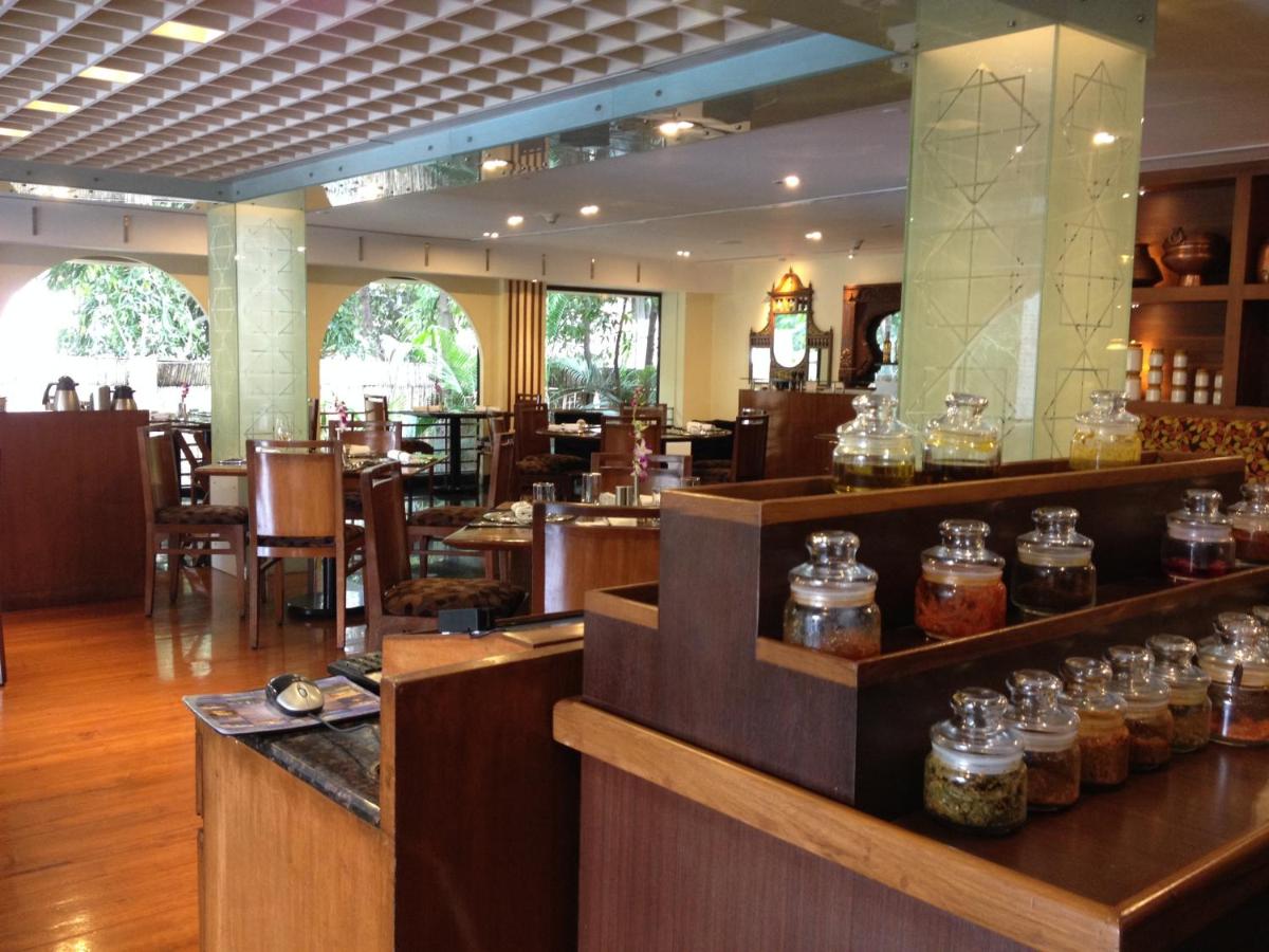 a restaurant with jars of honey on the counter at Blue Diamond Pune IHCL SeleQtions in Pune