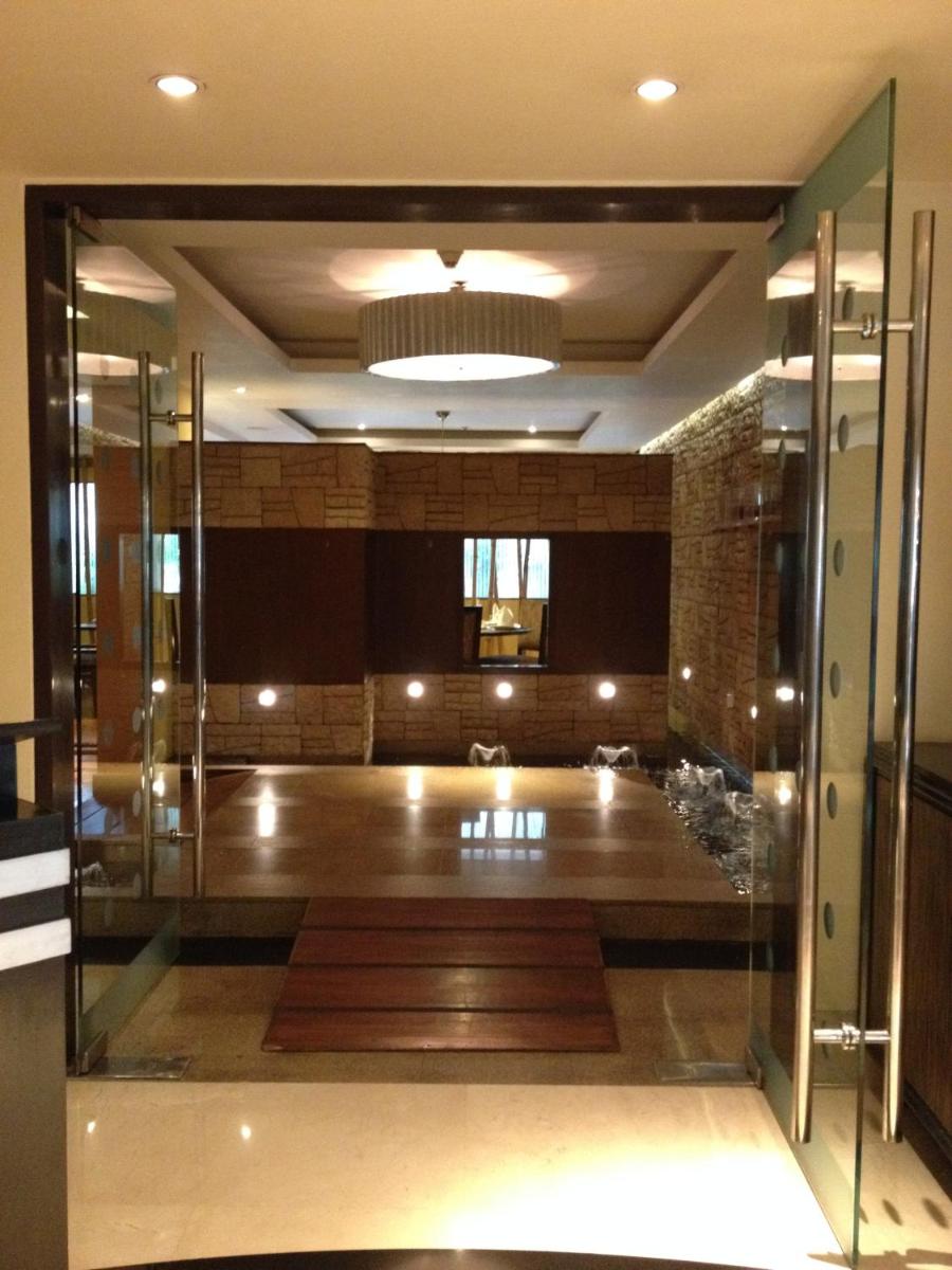 an open door to a room with a stage at Blue Diamond Pune IHCL SeleQtions in Pune