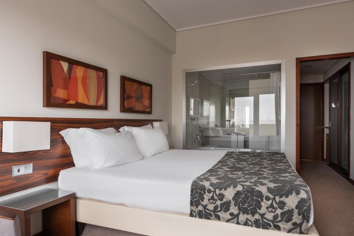 Uma cama ou camas num quarto em Dorma Praia Golfe
