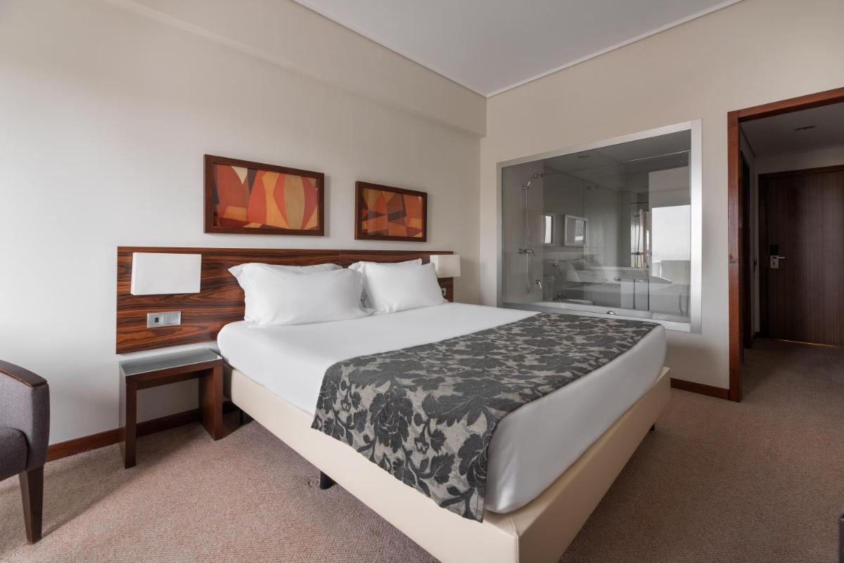 Uma cama ou camas num quarto em Dorma Praia Golfe